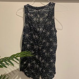 Cute sleeveless black sil blouse with white leaves